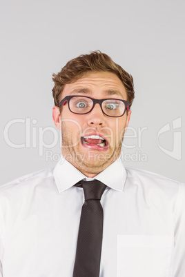 Geeky businessman looking at camera