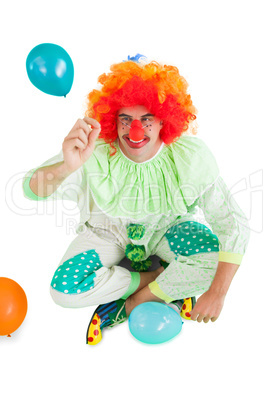 Funny clown holding hand up