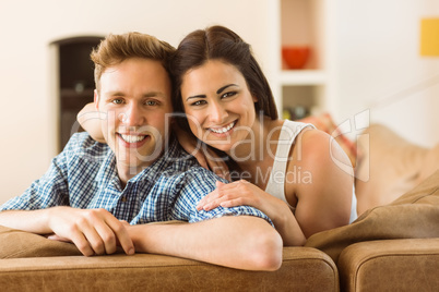 Happy young couple relaxing on the couch