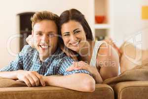 Happy young couple relaxing on the couch