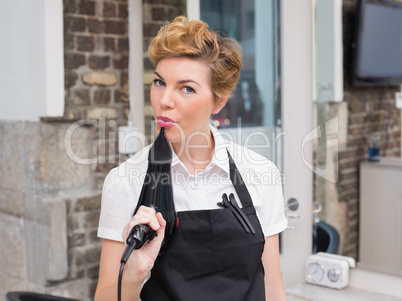 Confident hairdresser smiling at camera