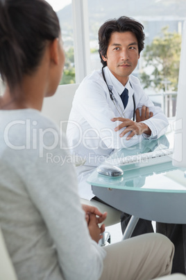Doctor listening to his patient
