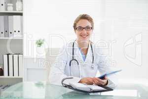 Doctor holding her tablet pc