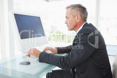 Serious employee on his pc