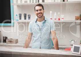 Happy hairdresser at work reception