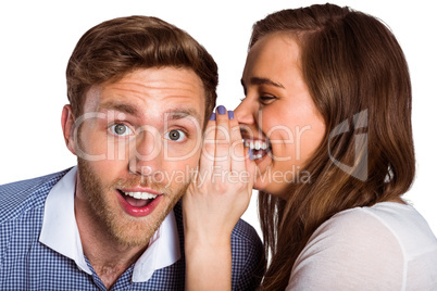 woman whispering secret into friends ear