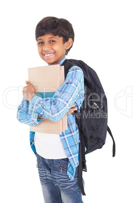 Cute elementary pupil smiling at camera