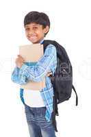 Cute elementary pupil smiling at camera