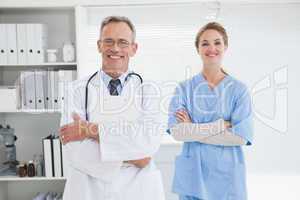 Smiling doctor with fellow co worker