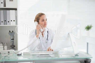 Doctor taking a phone call