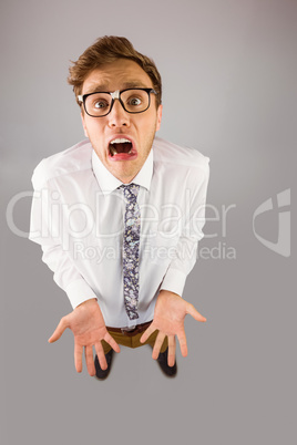 Geeky businessman gesturing to camera