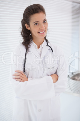 Doctor with stethoscope and arms folded