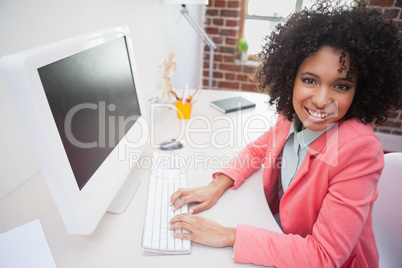 Casual businesswoman working on computer