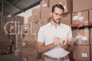 Warehouse worker with clipboard