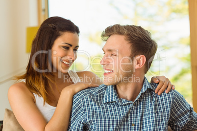 Happy young couple relaxing on the couch