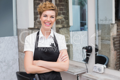 Confident hairdresser smiling at camera