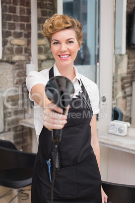 Confident hairdresser smiling at camera