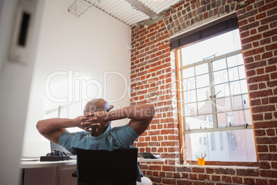 Casual businessman leaning back in chair