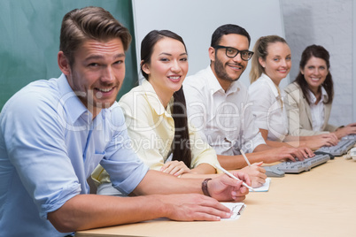 Five person Business team looking at camera and smiling
