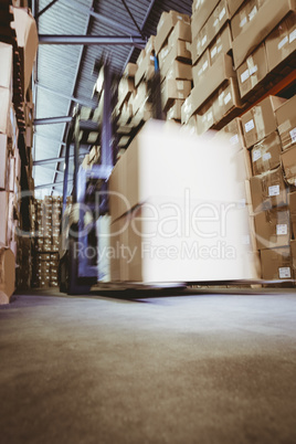 Forklift in large warehouse Forklift in large warehouse