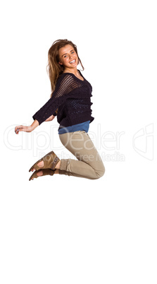 Full length of cheerful young woman jumping