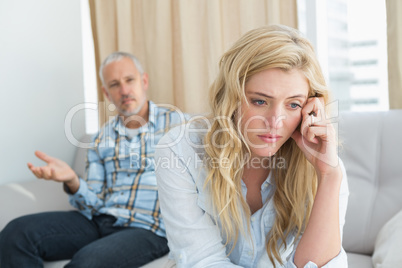 Couple arguing on the couch