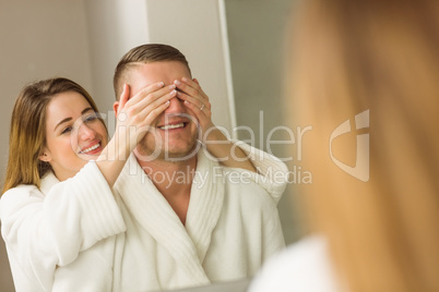 Woman covering her boyfriends eyes