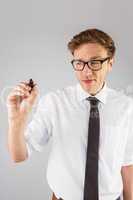 Geeky businessman writing with marker