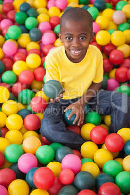 Cute boy smiling in ball pool