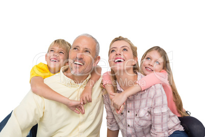 Happy family smiling and looking up