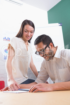 Casual colleagues using digital tablet