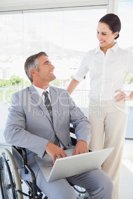 Disabled business man working with partner