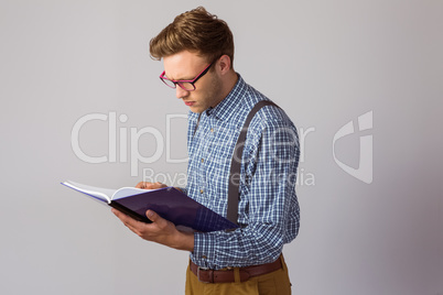 Geeky student reading a book