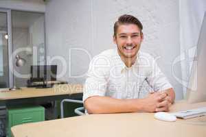 Portrait of businessman at office desk