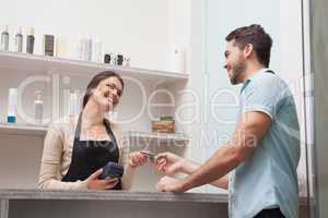 Hairdresser using a credit card