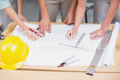 Architecture team working together at desk