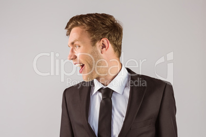 Young handsome businessman looking away