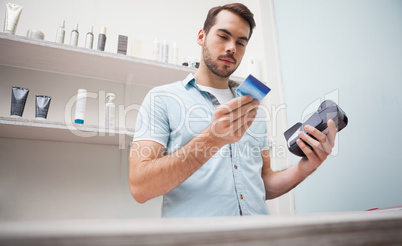 Hairdresser using a credit card