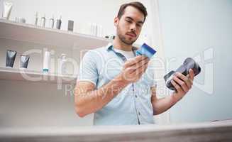 Hairdresser using a credit card