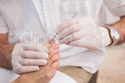 Salon worker with customers foot