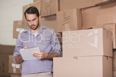 Warehouse worker with clipboard