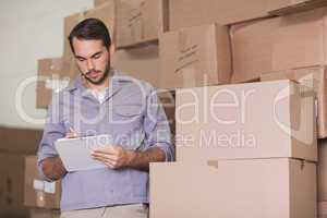 Warehouse worker with clipboard