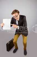 Young geeky businessman holding page