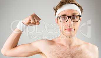 Geeky shirtless hipster flexing bicep