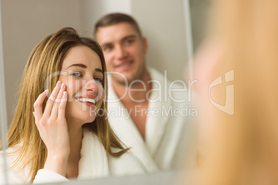 Pretty blonde looking in the mirror