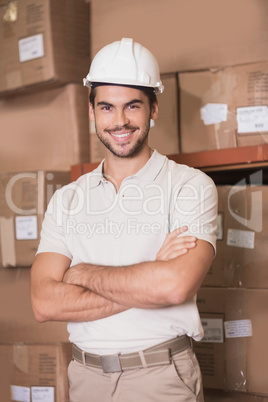 Worker wearing hard hat in warehouse