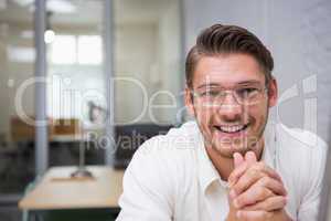 Cheerful young businessman at office