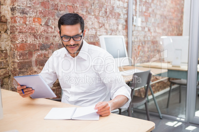 Businessman with paperwork at desk
