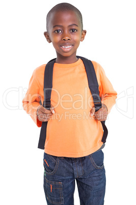 Cute elementary pupil smiling at camera