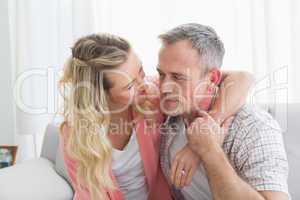 Portrait of a loving couple sitting on couch